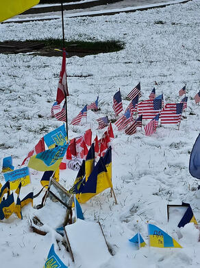 Flags of volunteers who died helping in Ukraine