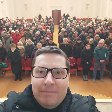It rained that winter Sunday, but wet people came to worship in an unheated building