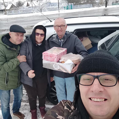 Pastor Aleksandr and Chris with a Ukrainian couple